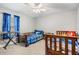 Cozy bedroom with twin beds, carpeting, a window, and blue accents for a comfortable living space at 2155 Thompson Rd, Bartow, FL 33830