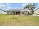 Charming single-story home features a manicured lawn and landscaping at 2155 Thompson Rd, Bartow, FL 33830