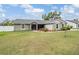 Charming home featuring a well-manicured lawn and complemented by beautiful landscaping at 2155 Thompson Rd, Bartow, FL 33830