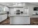 Bright kitchen featuring white cabinets, granite countertops, and a decorative island at 2155 Thompson Rd, Bartow, FL 33830