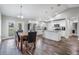 Bright kitchen open to dining area, featuring stainless steel appliances, island, and backyard access at 2155 Thompson Rd, Bartow, FL 33830