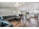 Inviting living room with vaulted ceilings, modern furnishings, and open layout to the kitchen at 2155 Thompson Rd, Bartow, FL 33830