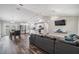 Open-concept living space featuring modern furnishings, wood-look floors, and a bright kitchen at 2155 Thompson Rd, Bartow, FL 33830