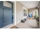 Relaxing front porch with a cozy hammock and stylish seating, perfect for enjoying quiet moments at 2155 Thompson Rd, Bartow, FL 33830