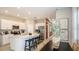 Modern kitchen features an island with seating, stainless steel appliances, and ample counter space at 2537 Penguin Blvd, Davenport, FL 33837