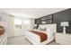 Well-lit main bedroom with carpeted floors, a neutral color palette, and stylish decor at 2537 Penguin Blvd, Davenport, FL 33837