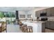 Open kitchen featuring a large island, modern gray cabinets and stainless steel appliances at 2565 Penguin Blvd, Davenport, FL 33837