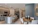 Eat-in kitchen island with pendant lighting, open to the dining and living areas at 2565 Penguin Blvd, Davenport, FL 33837