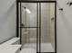 Modern bathroom features a glass shower and a neutral tiled shower at 6615 Quest St, St Cloud, FL 34771