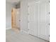 Bedroom showcasing double doors and carpet flooring, offering both style and comfort at 6615 Quest St, St Cloud, FL 34771