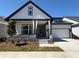 Charming two-story home featuring stone accents, modern architectural details and an attached two car garage at 6615 Quest St, St Cloud, FL 34771