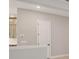 Open hallway area near kitchen with doorway and white molding at 6615 Quest St, St Cloud, FL 34771