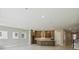 Open concept kitchen with stainless steel appliances, center island, and ample cabinet space at 6615 Quest St, St Cloud, FL 34771