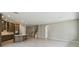 Spacious living room open to kitchen with tile flooring and plenty of natural light at 6615 Quest St, St Cloud, FL 34771