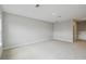 Bright and expansive living room with soft carpet and neutral paint at 6615 Quest St, St Cloud, FL 34771