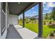 Covered patio with gray flooring and dark gray support posts, perfect for outdoor entertaining at 6615 Quest St, St Cloud, FL 34771