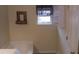 A bathroom featuring a window, a bathtub and storage shelves above the toilet at 5118 Log Wagon Rd, Ocoee, FL 34761