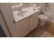 A bathroom featuring a sink, toilet, vanity, mirror, with tile flooring at 5118 Log Wagon Rd, Ocoee, FL 34761