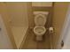 Bathroom with standard toilet, shower and tile flooring at 5118 Log Wagon Rd, Ocoee, FL 34761