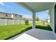 Spacious backyard featuring a well-maintained lawn and a white vinyl fence at 5774 Greenery Ln, St Cloud, FL 34771