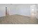 Spacious tiled bedroom with a view to ensuite bathroom, and walk-in closet at 5774 Greenery Ln, St Cloud, FL 34771