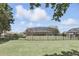 The fenced backyard features a well-maintained lawn with an enclosed patio, offering privacy and space at 1372 Madison Ivy Cir, Apopka, FL 32712