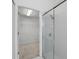 A glass door shower stall sits next to an open walk-in closet with carpet at 1372 Madison Ivy Cir, Apopka, FL 32712