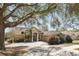 Charming home with a brick driveway, mature trees, and well-manicured landscaping at 1372 Madison Ivy Cir, Apopka, FL 32712