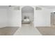 Inviting foyer featuring tile and carpet flooring, and a view of the living area at 1372 Madison Ivy Cir, Apopka, FL 32712