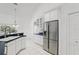 Modern kitchen featuring stainless steel appliances, undermount sink, and ample cabinet space at 1372 Madison Ivy Cir, Apopka, FL 32712
