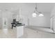 Cozy living space featuring a kitchen with stainless steel appliances at 1372 Madison Ivy Cir, Apopka, FL 32712