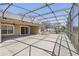 This expansive screened-in patio is the perfect space for relaxation, featuring a hot tub and seamless indoor-outdoor living at 1372 Madison Ivy Cir, Apopka, FL 32712