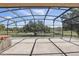 Enclosed patio with view of a pond and mature trees at 1372 Madison Ivy Cir, Apopka, FL 32712