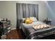 Bedroom with hardwood flooring, and a window with heavy curtains at 14417 Jasmine Glen Dr, Orlando, FL 32824