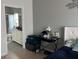 Bedroom featuring neutral wall paint, tile flooring, and an ensuite bathroom at 14417 Jasmine Glen Dr, Orlando, FL 32824