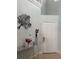 Inviting entryway with tile floor, decorative mirror table, and artwork at 14417 Jasmine Glen Dr, Orlando, FL 32824