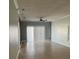 Spacious living room with tile floors, a ceiling fan, and sliding glass doors leading to the outside at 14417 Jasmine Glen Dr, Orlando, FL 32824