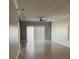 Spacious living room with tiled floor, natural light, and a ceiling fan at 14417 Jasmine Glen Dr, Orlando, FL 32824