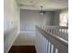 Bright loft area featuring plush carpeting and a ceiling fan, offering versatile living space at 14417 Jasmine Glen Dr, Orlando, FL 32824