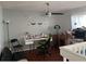 A home office featuring hard wood floors, a ceiling fan, and ample natural light at 14417 Jasmine Glen Dr, Orlando, FL 32824