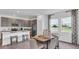 Modern dining room featuring a wooden table, stylish chairs, and lots of natural light at 750 Honeyrock St, Debary, FL 32713