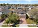 Expansive aerial view of a well-maintained home in a peaceful neighborhood with mature trees and lush landscaping at 754 Andalusia Loop, Davenport, FL 33837