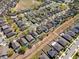 An aerial view of a neighborhood showing rooftops, swimming pools and community landscaping at 754 Andalusia Loop, Davenport, FL 33837