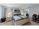 Comfortable bedroom with soft carpet, large bed, patterned curtains, bedside tables, and soothing natural light at 754 Andalusia Loop, Davenport, FL 33837