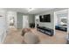 Carpeted bonus room with beanbag chairs, TV, and extra room to relax and play at 754 Andalusia Loop, Davenport, FL 33837