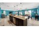 Bright kitchen with granite countertops, stainless steel appliances, and an open view to the dining and living areas at 754 Andalusia Loop, Davenport, FL 33837