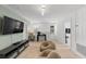 Upstairs loft area with modern entertainment center and bean bag seating, perfect for relaxation at 754 Andalusia Loop, Davenport, FL 33837