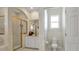 Bathroom featuring a glass shower door and a toilet in separate enclosure at 867 Hanover Way, Lakeland, FL 33813