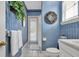 Charming bathroom with blue wallpaper and lots of natural light at 867 Hanover Way, Lakeland, FL 33813