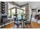 Dining area with a glass table, seating four, and a view of the pool at 867 Hanover Way, Lakeland, FL 33813